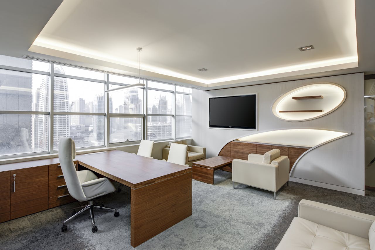 mobile-02 Sleek office space featuring contemporary furniture and city skyline views, ideal for professionals.
