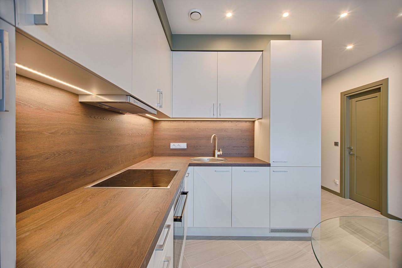 creative Modern kitchen interior with minimalistic design and wooden accents, captured with natural lighting.